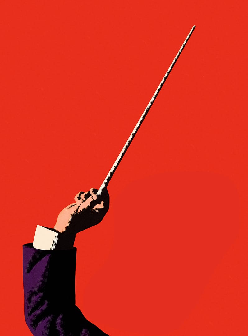 Un bras de chef d'orchestre tenant une baguette